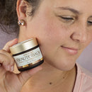 Bakuchiol Anti-Aging Tallow Face Cream, Fairest Flower, Woman Holding Jar